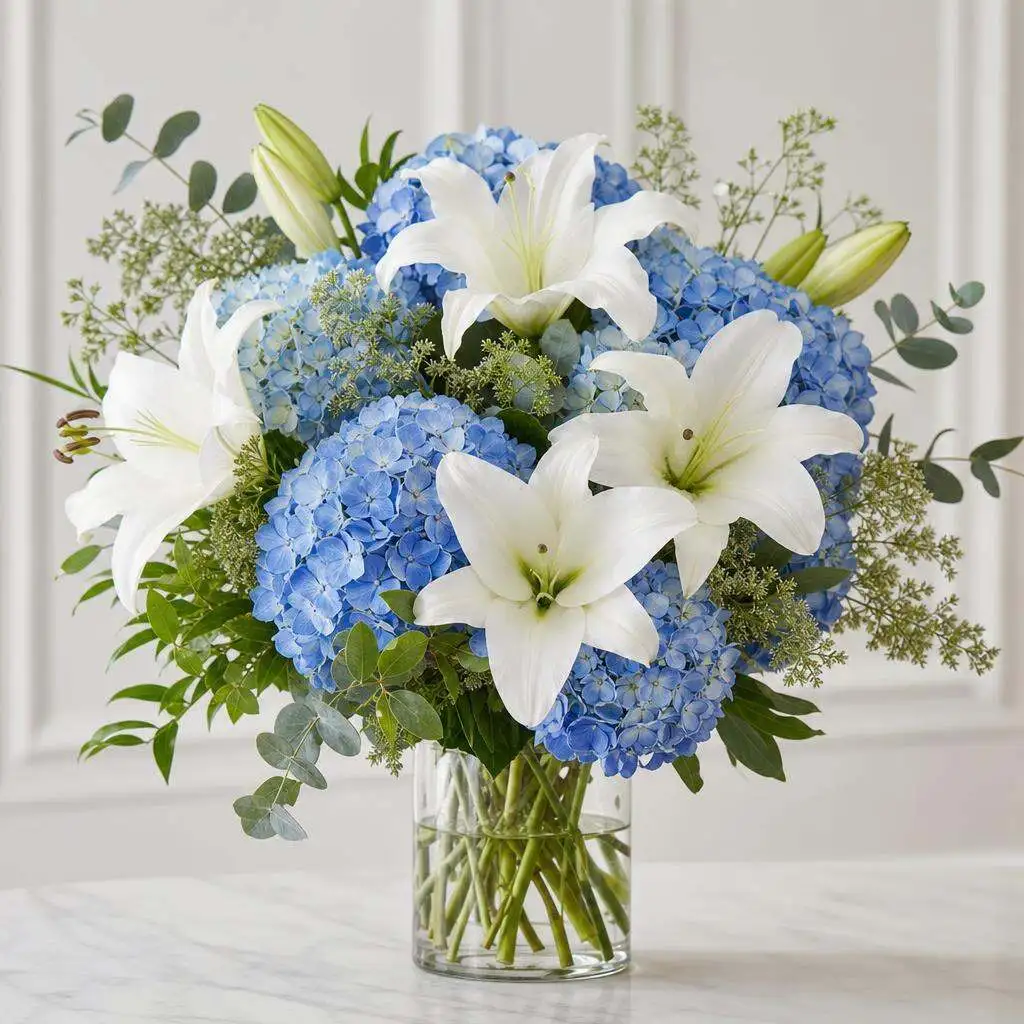 Lily and hydrangea arrangement by Bentley Florist